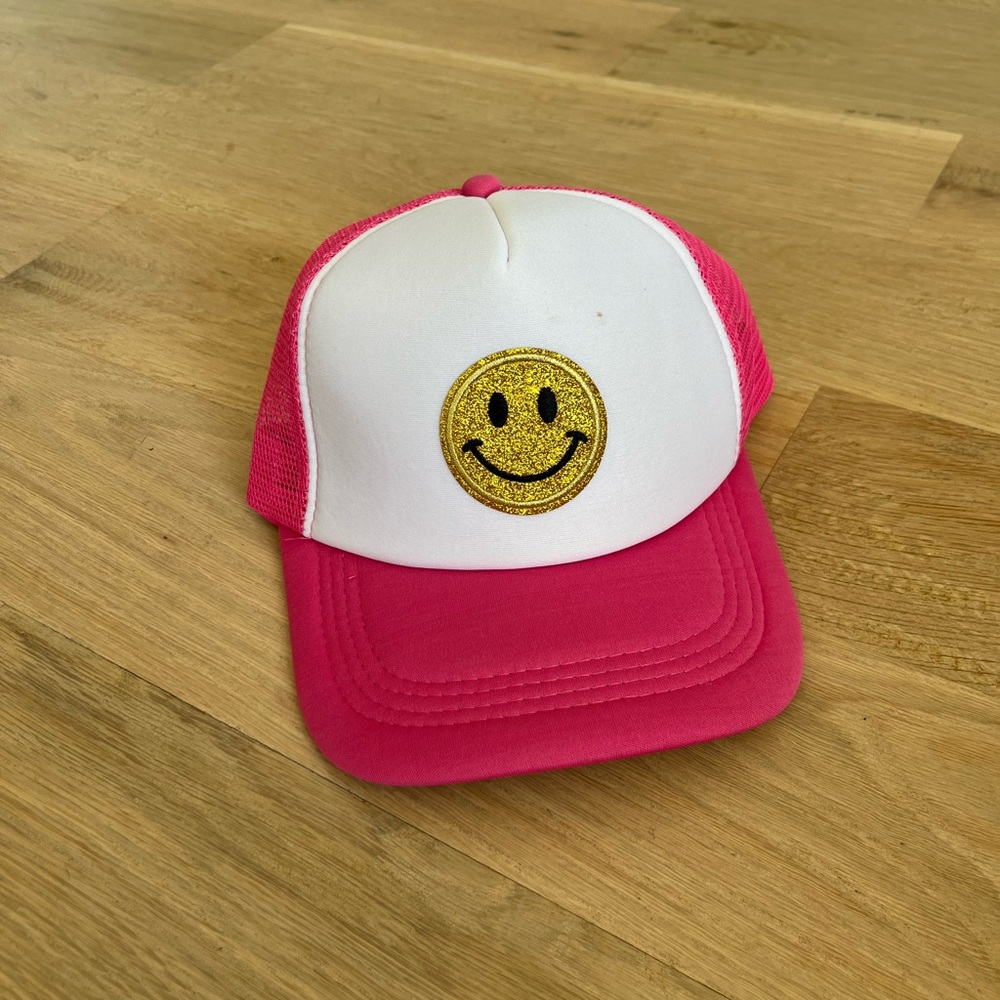 Preppy smiley face pink and white trucker hat